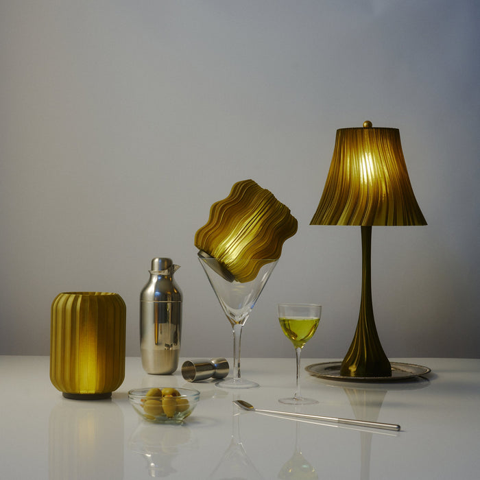 Wooj Design cordless mini wavy lamp with a sleek, modern design, placed on a wooden surface with a soft background.