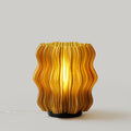 Mini wavy lamp by Wooj Design with a sleek, wave-shaped design in gray, perfect for modern home decor.