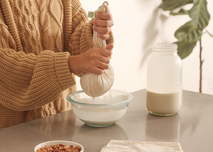 Organic Cotton Mart nut milk bags used as colanders and strainers for homemade nut milk and nut-based recipes.
