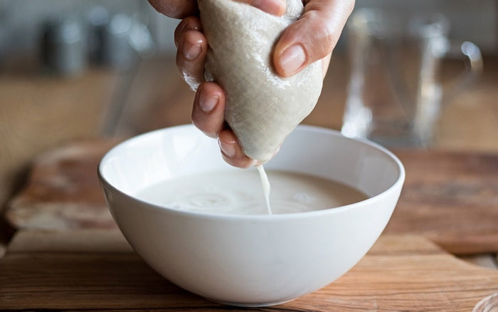 Organic cotton nut milk bags used as strainers, suitable for making nut milk and filtering liquids in the kitchen.