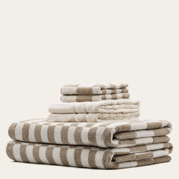 Soft Pietra Australian Cotton Towels by Italic, featuring plush texture and neutral color, displayed folded on a clean bathroom surface.