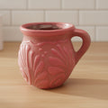 Pink Talavera mug with colorful hand-painted floral design, traditional Mexican pottery style from The Talavera Hub.