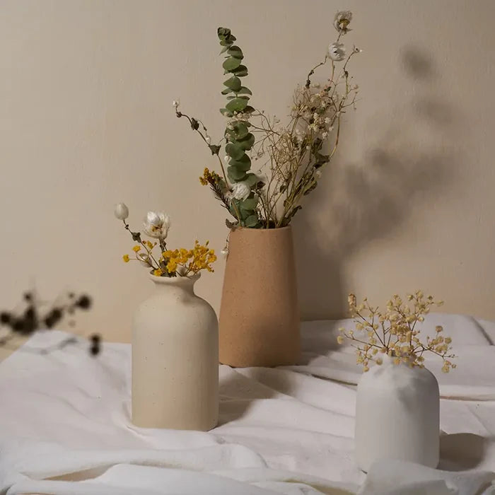 Simple ceramic vase with a smooth finish, ideal for home décor, by My Store.